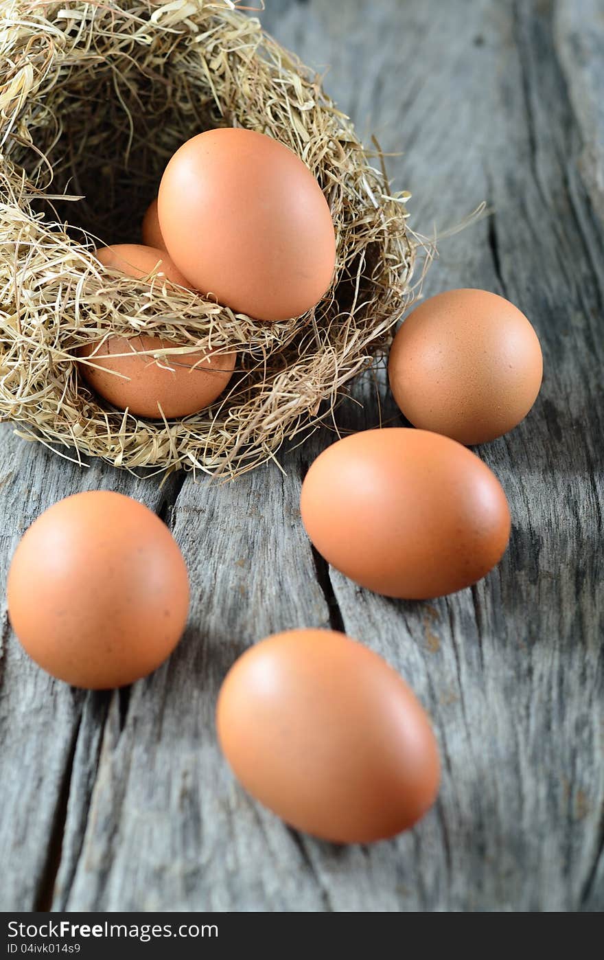 Colorful eggs on old wooden background