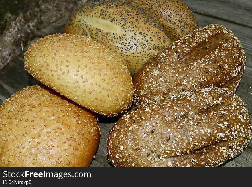 Bread bun closeup with seed, on a pier.