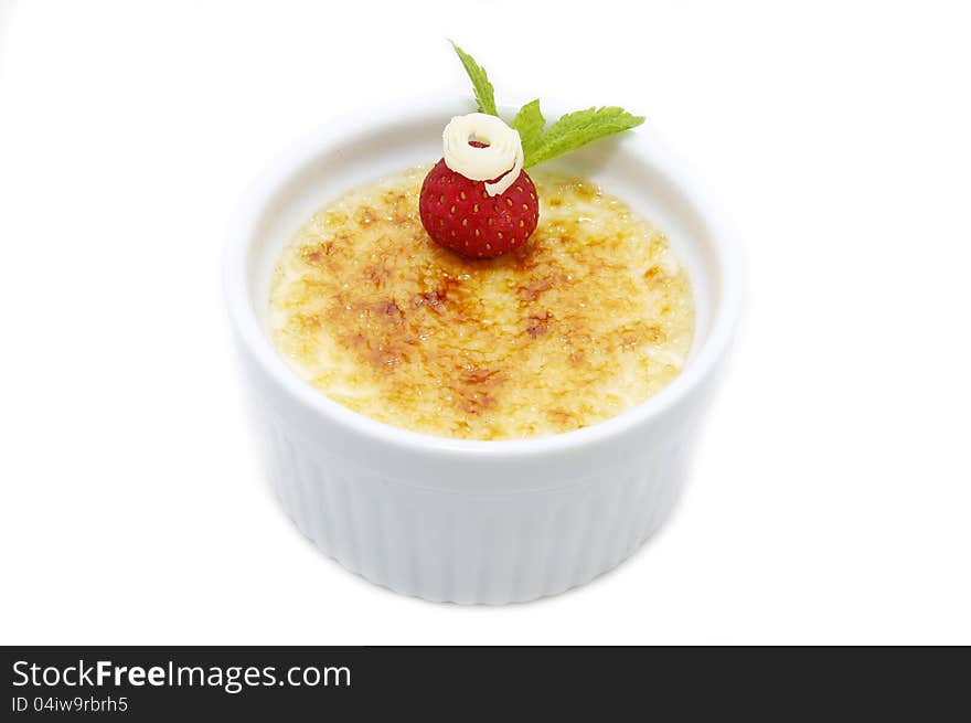 Serving of cream brulee on a table in a restaurant