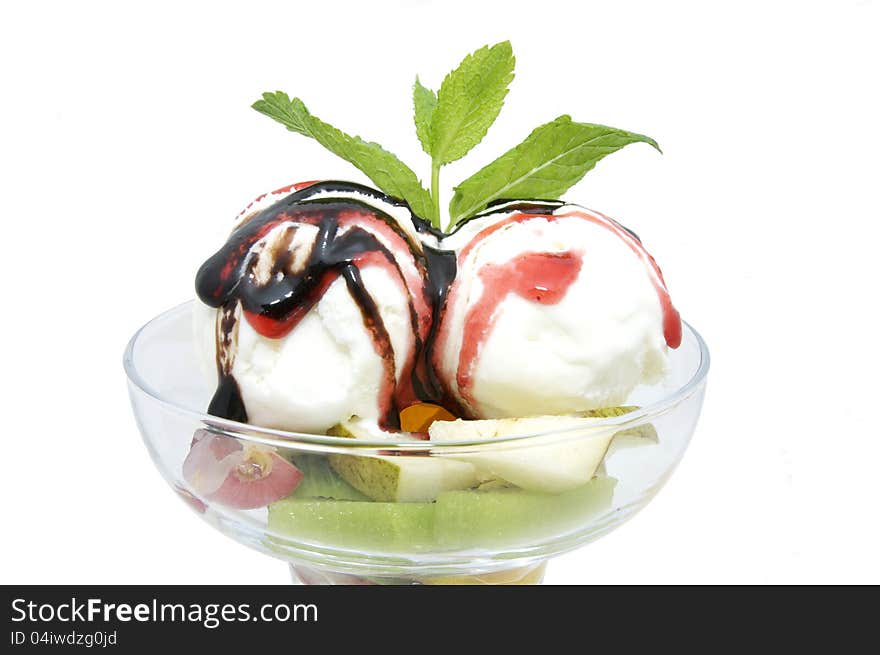 Ice cream with caramel sauce and mint on a white background. Ice cream with caramel sauce and mint on a white background