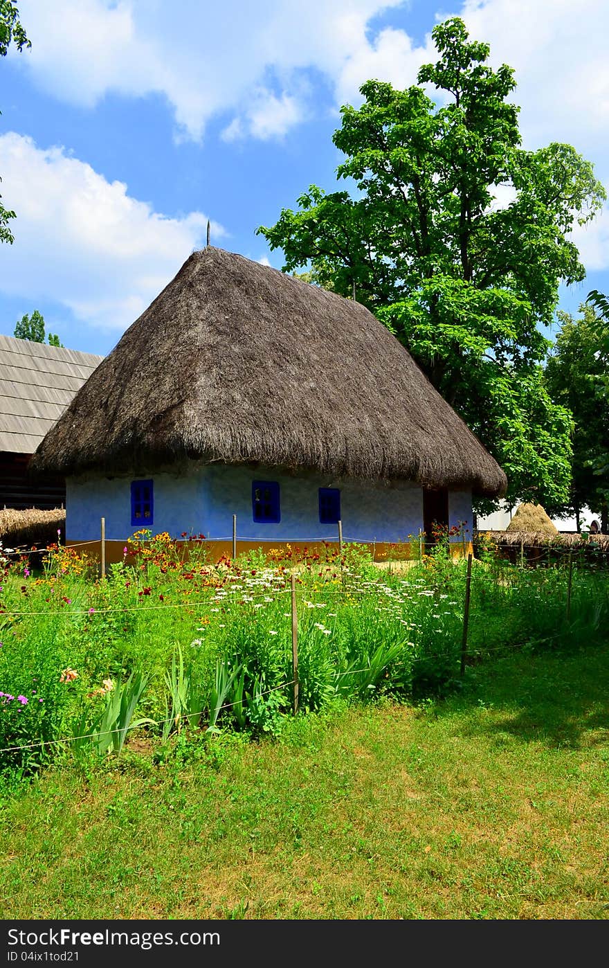 Countryside house with a garden filled with flowers representing peace and purity. Countryside house with a garden filled with flowers representing peace and purity