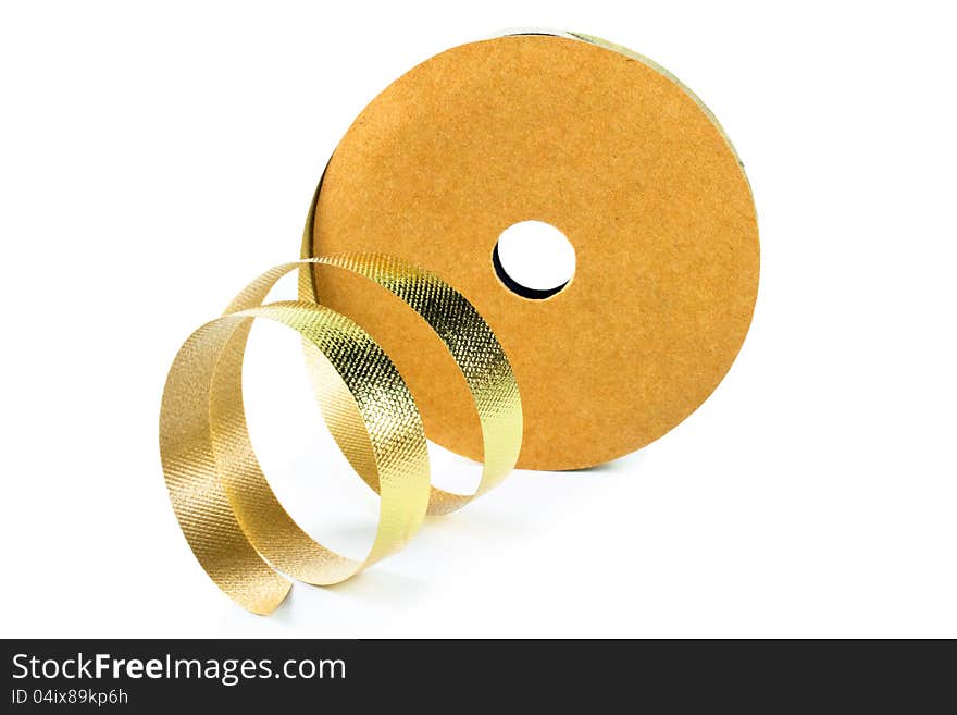 Roll of gold ribbon solated on white background. Roll of gold ribbon solated on white background