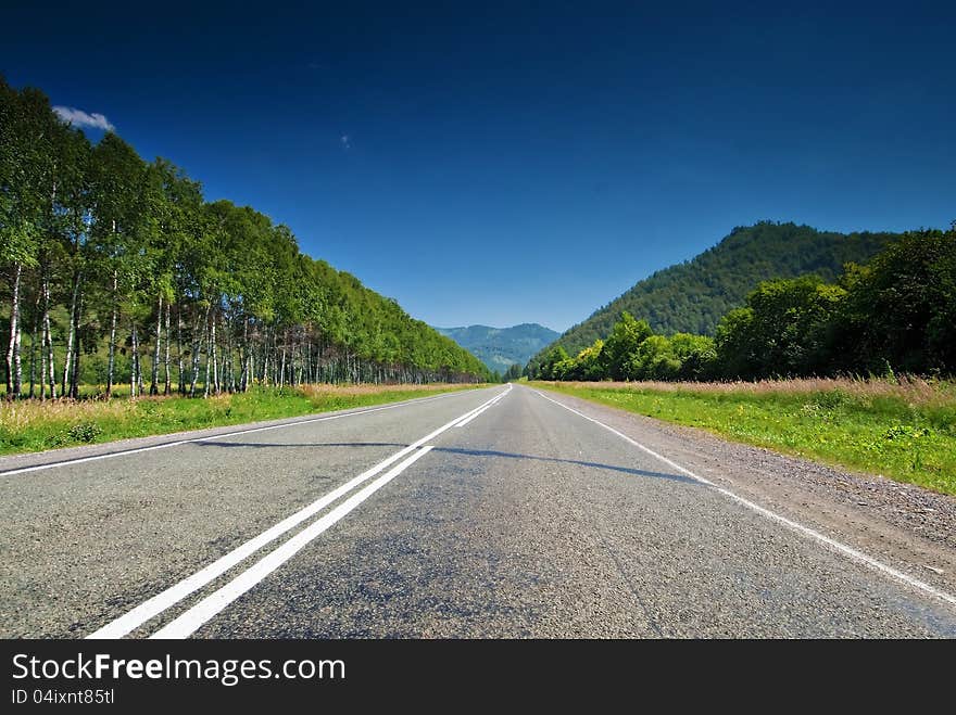 The direct road leading into the mountains.