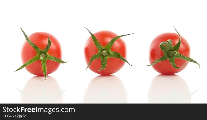 Three tomatoes with reflection isolated on white background. Three tomatoes with reflection isolated on white background