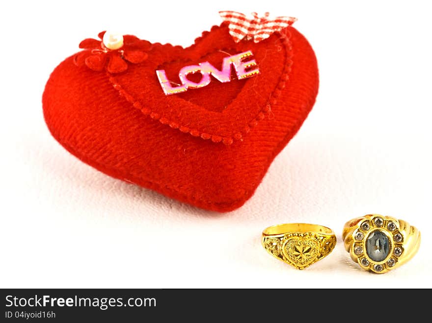 The golden rings and red heart.