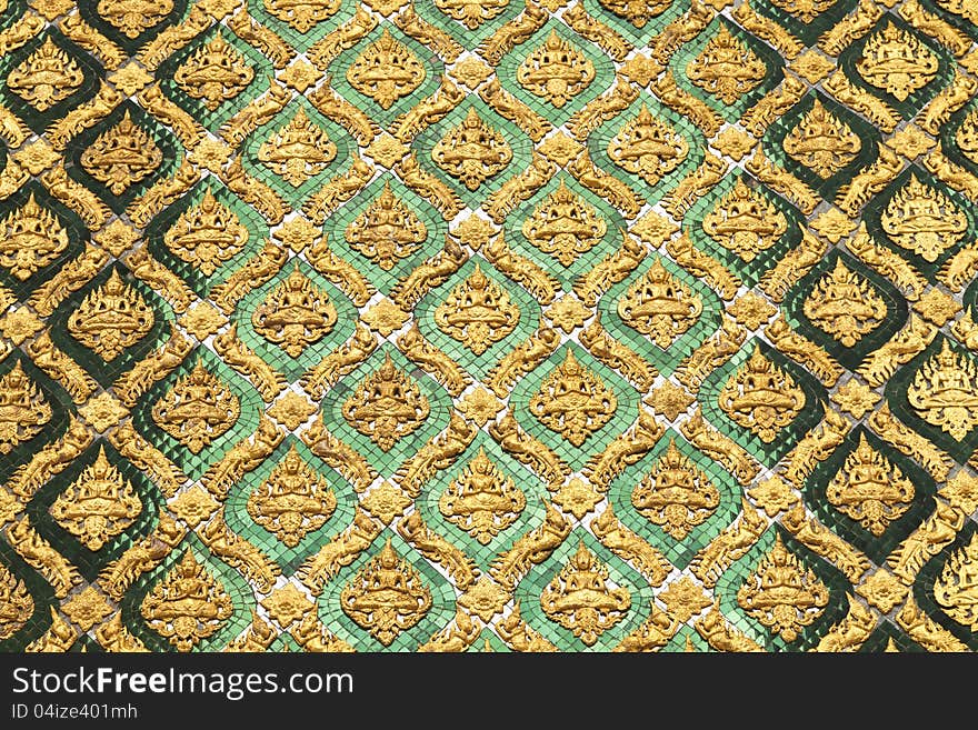 Pattern of Thai art made fom stucco and tile of color glass