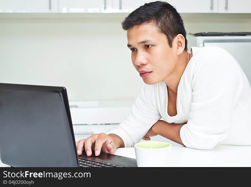 Cute asian young Man with Laptop. Cute asian young Man with Laptop