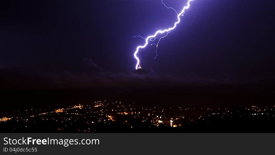 Lightning over the city on the evening.