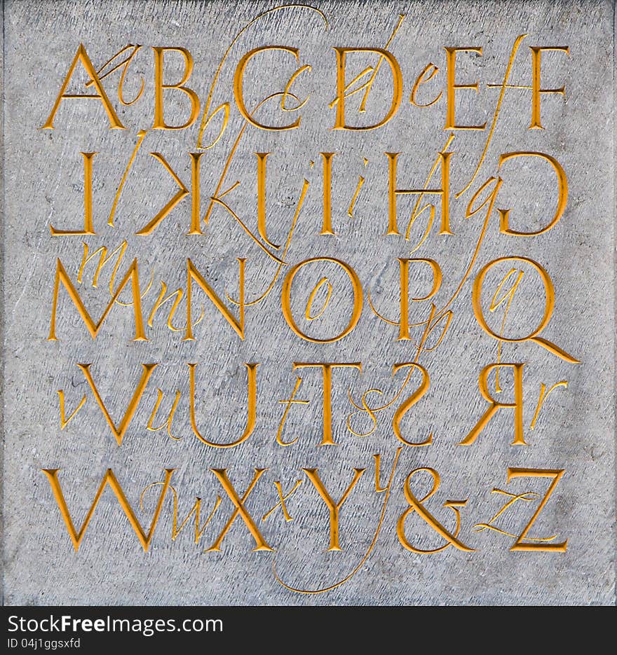 Background with letters on stone surface. Background with letters on stone surface