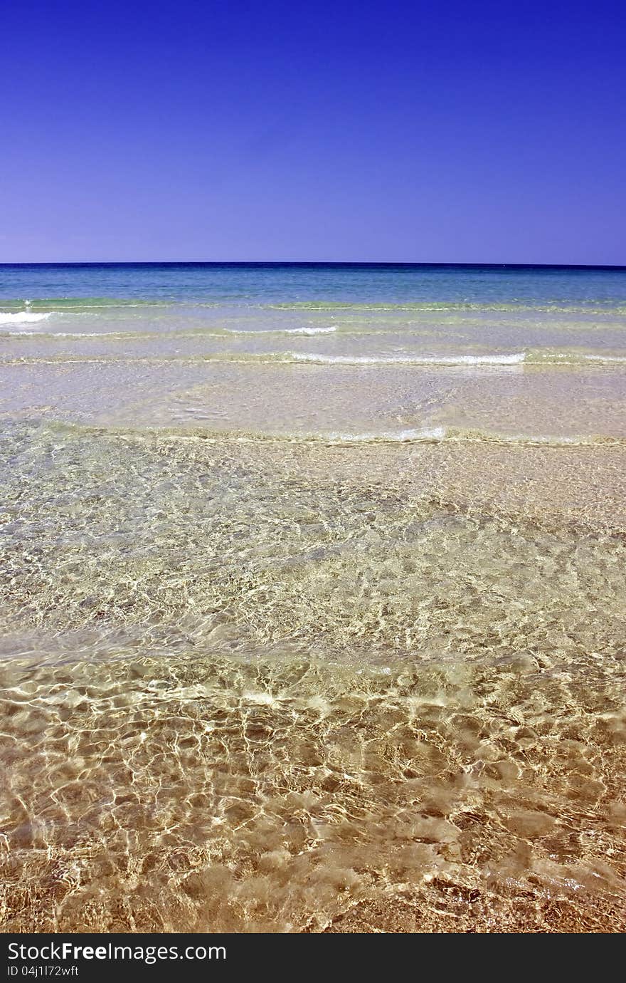 Beautiful tropical beach with cristal clear water and golden sand