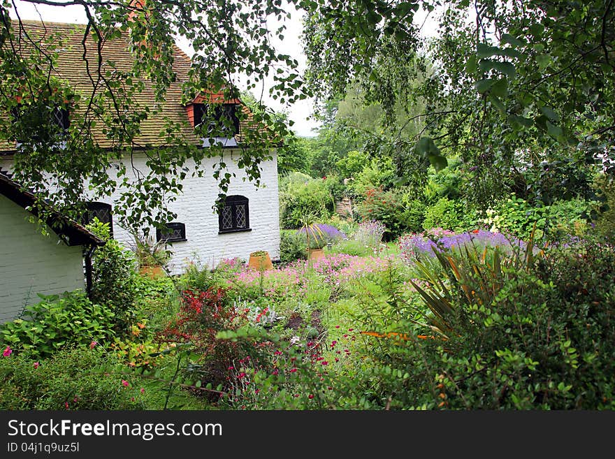 Photo of a beautiful kent chateau in the village of westbere nestling in immaculate landscaped garden.