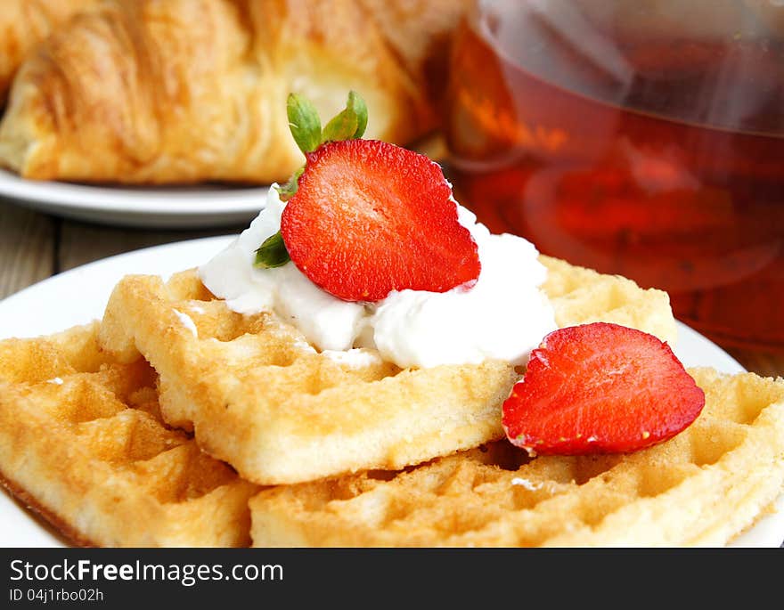 Tasty breakfast - tea, croissants and wafers