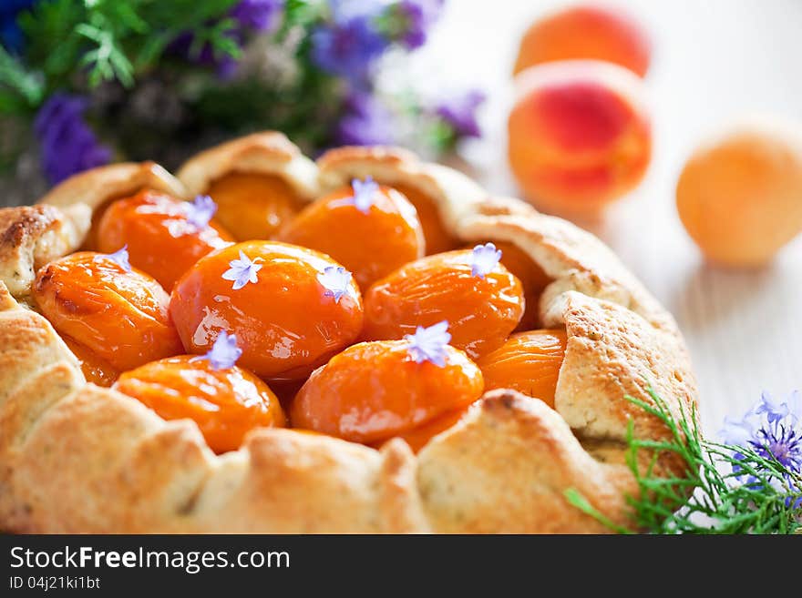 Tart with apricots and lavender, selective focus