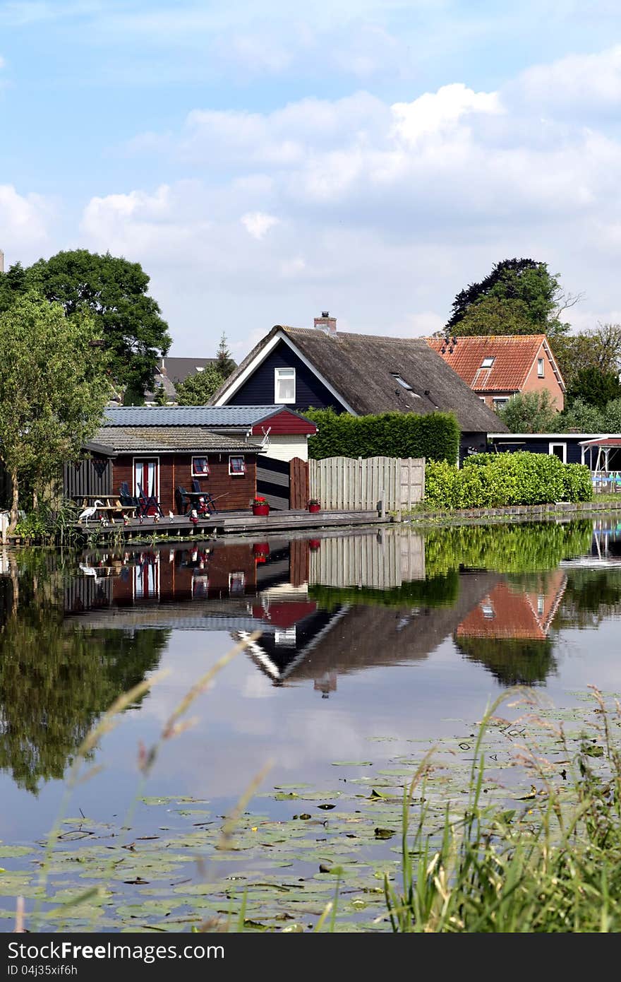 Traditional houses and canal in Holland. Traditional houses and canal in Holland