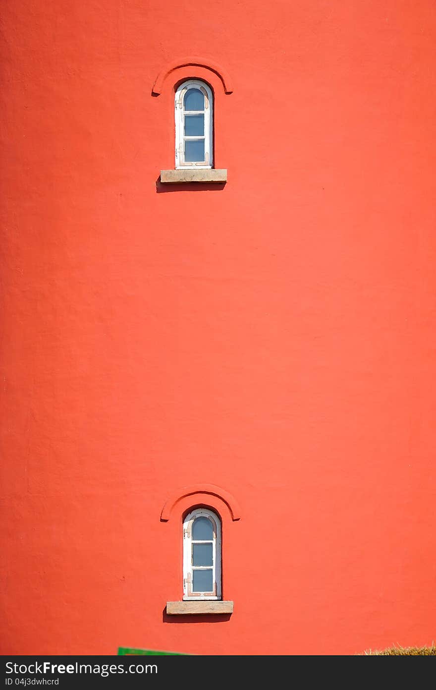 Red building with two small windows