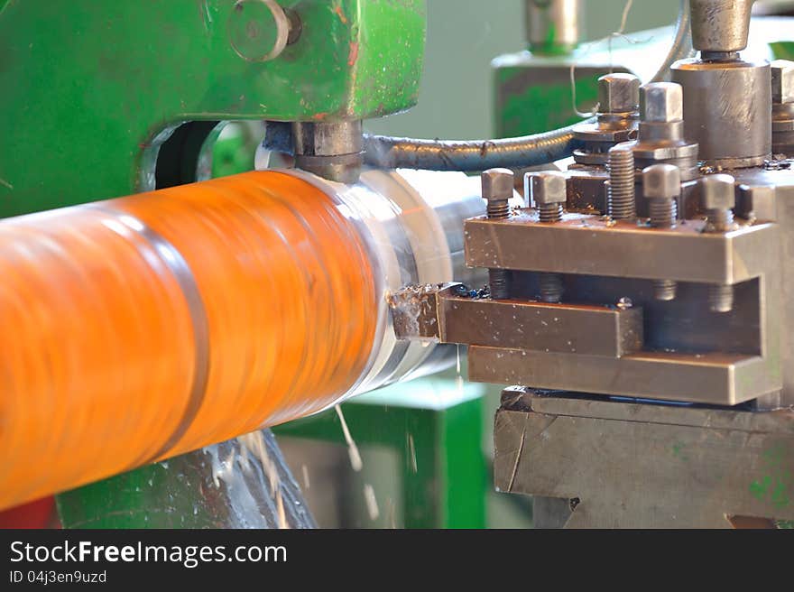 Turning lathe in action inside of factory