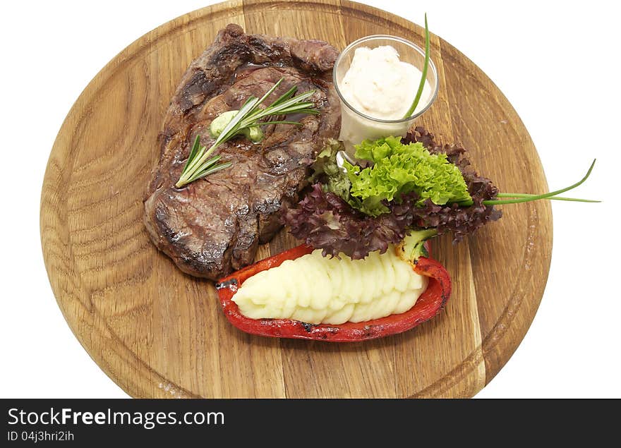 Steak sauce and greens on a white background. Steak sauce and greens on a white background