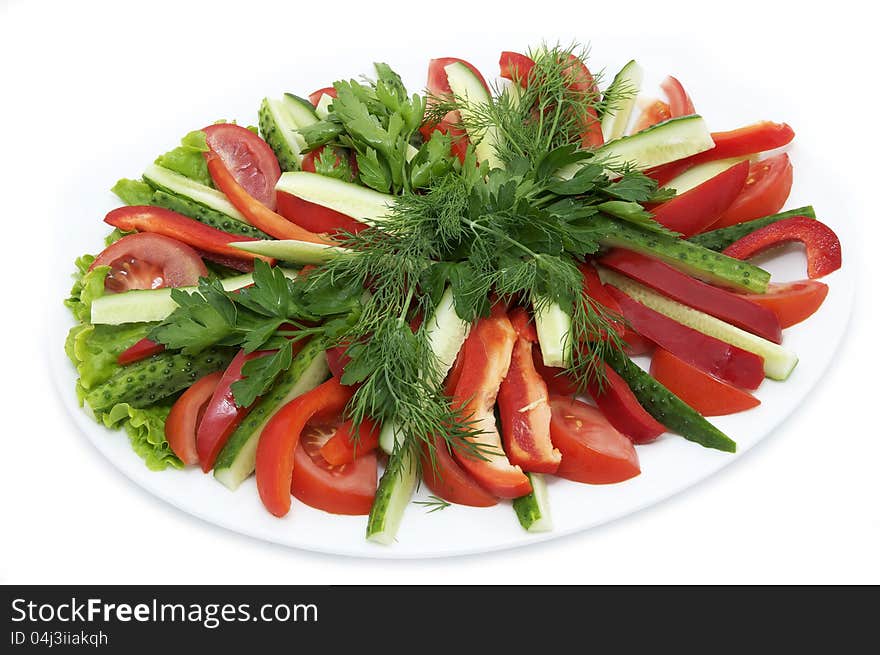 A plate of tomatoes and cucumbers, peppers. A plate of tomatoes and cucumbers, peppers