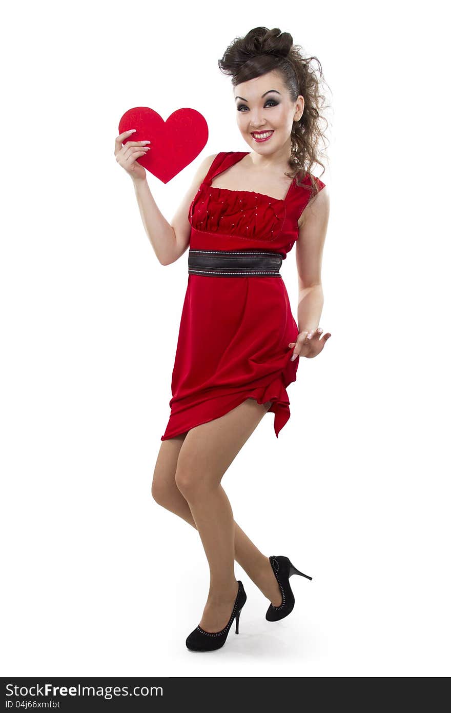 Beautiful Asian woman in a red dress shows the heart form - a love symbol. Beautiful Asian woman in a red dress shows the heart form - a love symbol