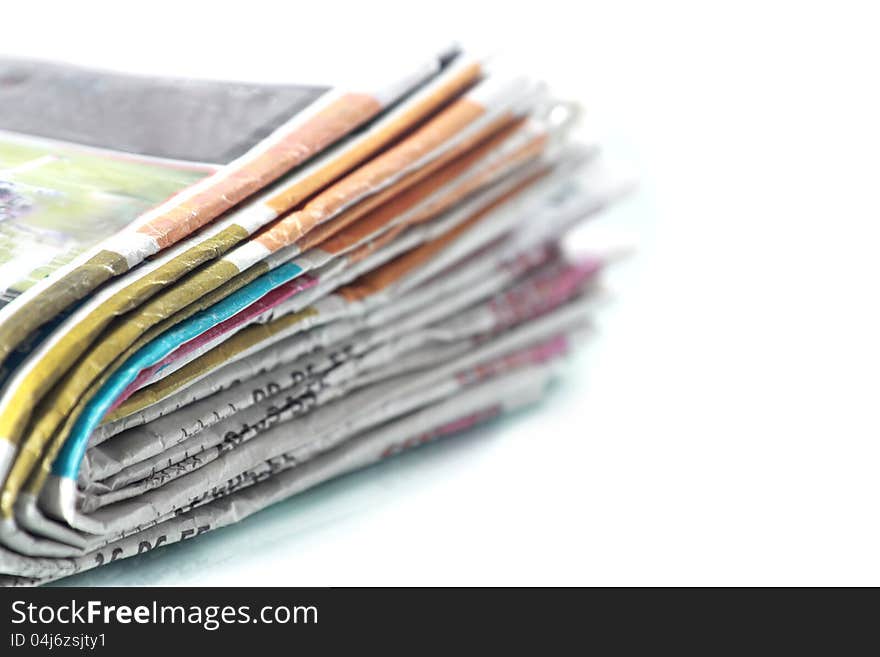 Old newspapers pile up On white background