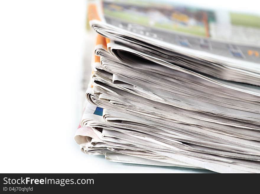 Old newspapers pile up On white background