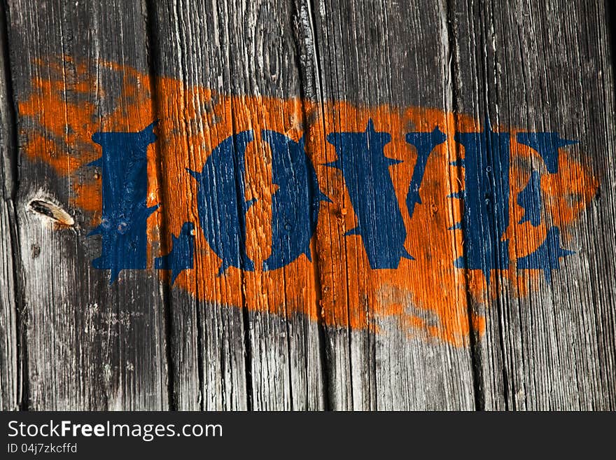 Spiny love blue in orange on fence. Spiny love blue in orange on fence