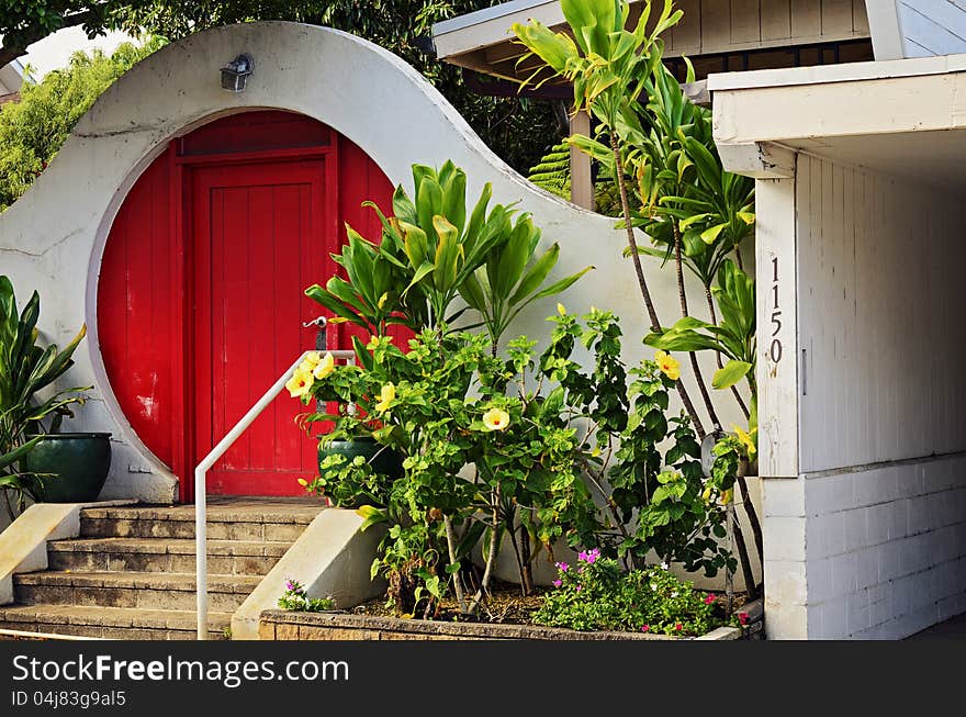 A circular red door and unique architecture. A circular red door and unique architecture.