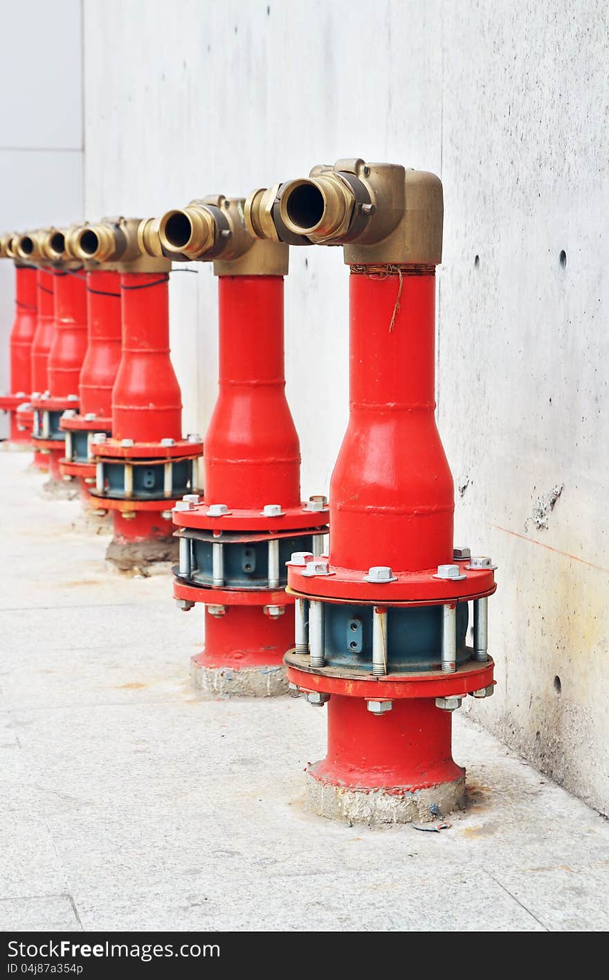 Row of fire hydrant beside the building