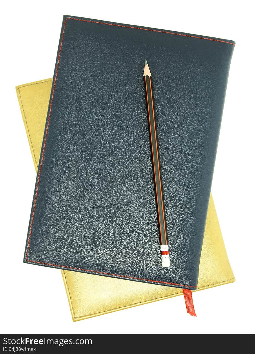 Stack of leather notebook and pencil isolated on white with clipping path