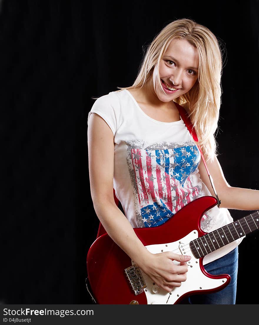 Woman Playing The Guitar