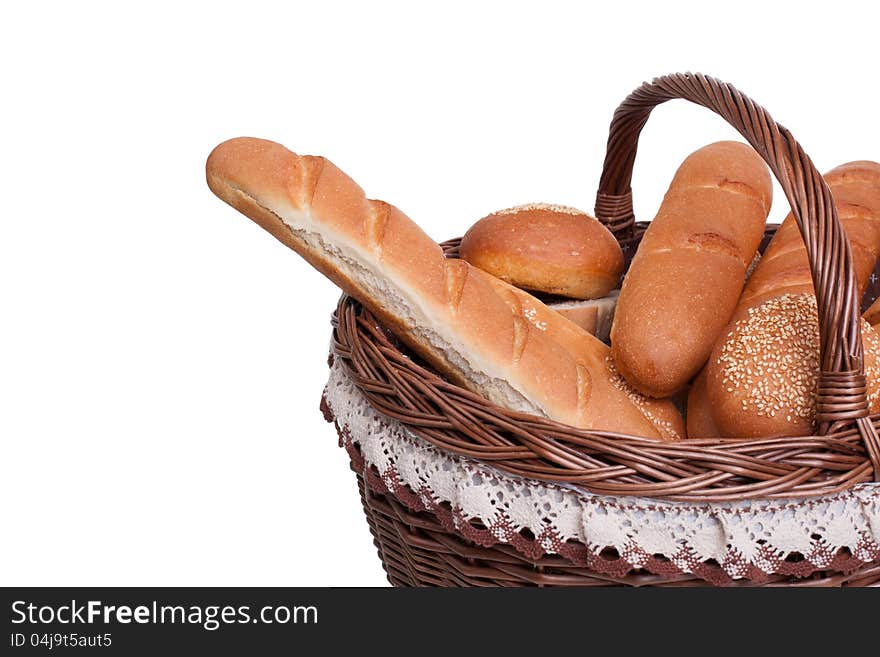 Arrangement of bread in basket isolated on white background