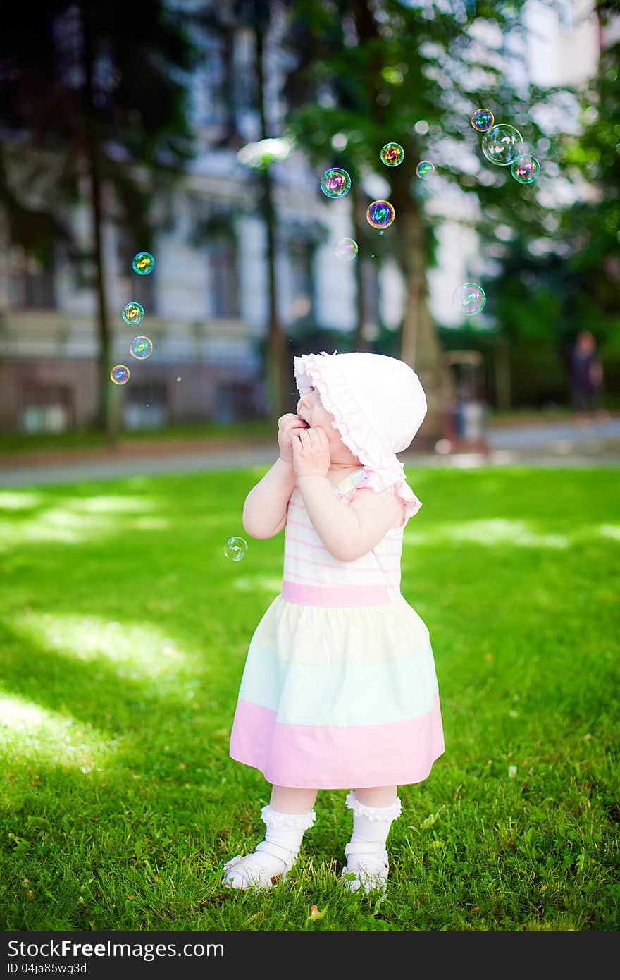 Little girl staring in amazement at soup bubbles. Little girl staring in amazement at soup bubbles