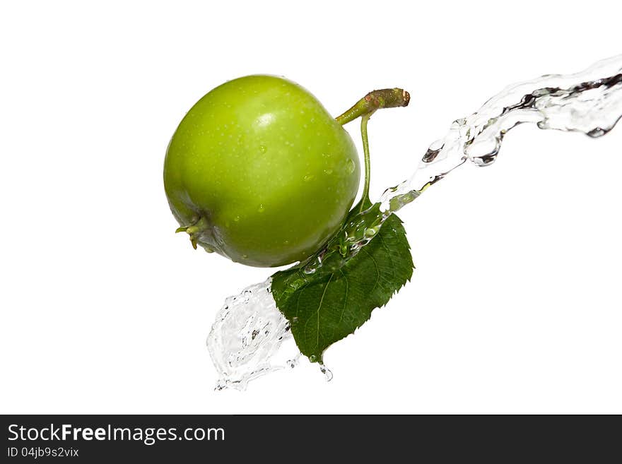 Green apple with a leaf in water. Green apple with a leaf in water