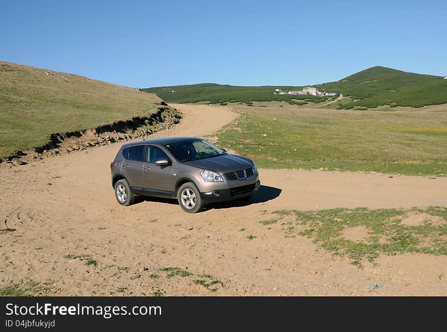 Terrain car on mountain roads. Terrain car on mountain roads