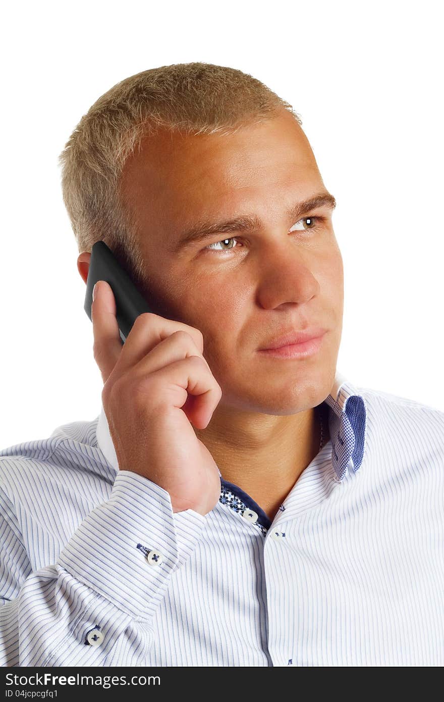 Businessman talking on mobile phone on a white background. Businessman talking on mobile phone on a white background.