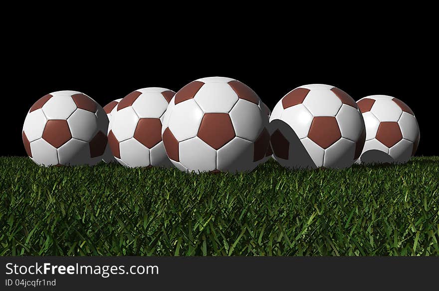 Brown soccer balls on a green grass - black background