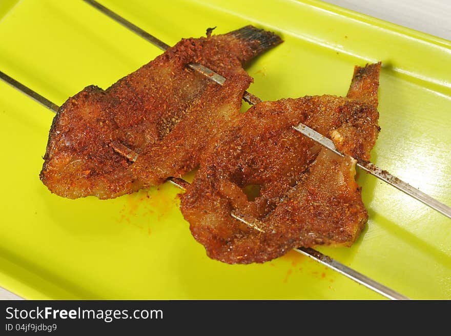 Barbecue; grilled fish on a plate