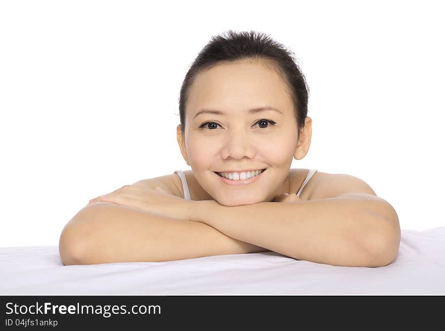 Close up of a brunette smiling woman relaxing on in a wellness center. Close up of a brunette smiling woman relaxing on in a wellness center