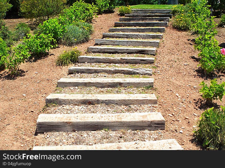 Wooden stairs in the garden. Summer.