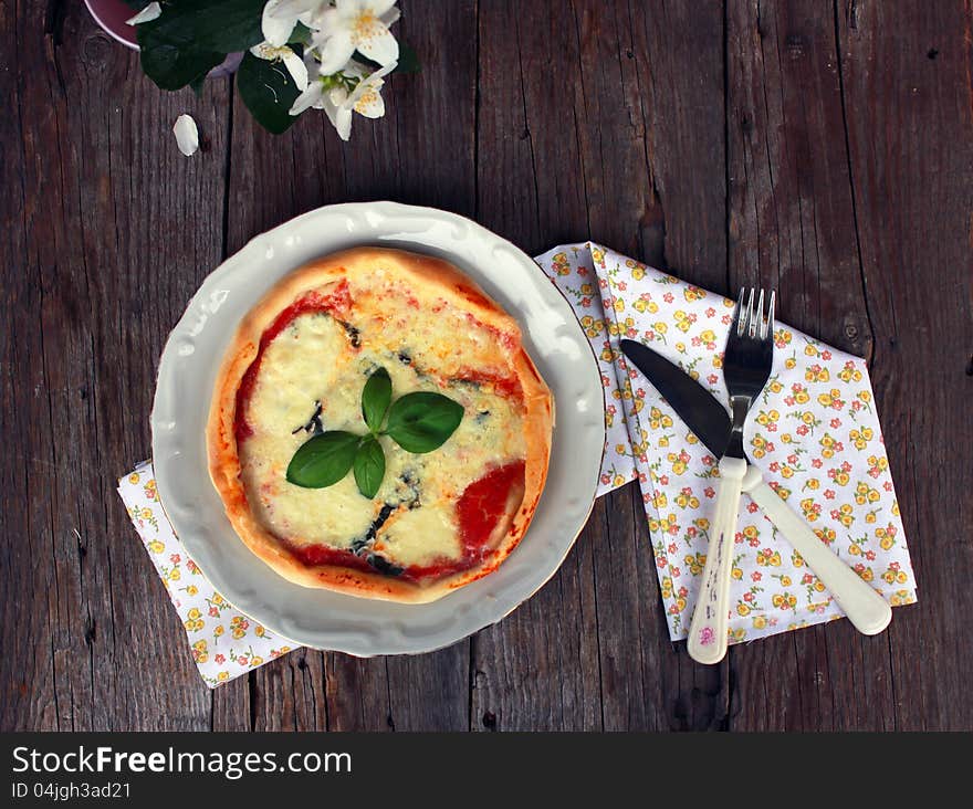 Vintage photo of a pizza margarita. Vintage photo of a pizza margarita