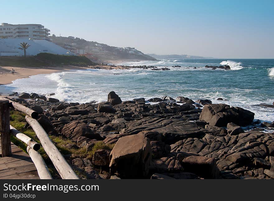 The coastline at Ballito, KwaZulu-Natal Noth coast, South Africa, with beaches interspersed with rocky outcrops, and holiday accommodation in the distance. The coastline at Ballito, KwaZulu-Natal Noth coast, South Africa, with beaches interspersed with rocky outcrops, and holiday accommodation in the distance.