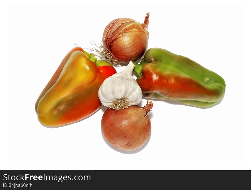 Sweet pepper, garlic and onions isolated on the white background. Sweet pepper, garlic and onions isolated on the white background