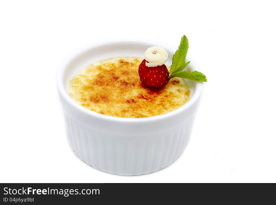 Portion of the cream brulee on a white background. Portion of the cream brulee on a white background