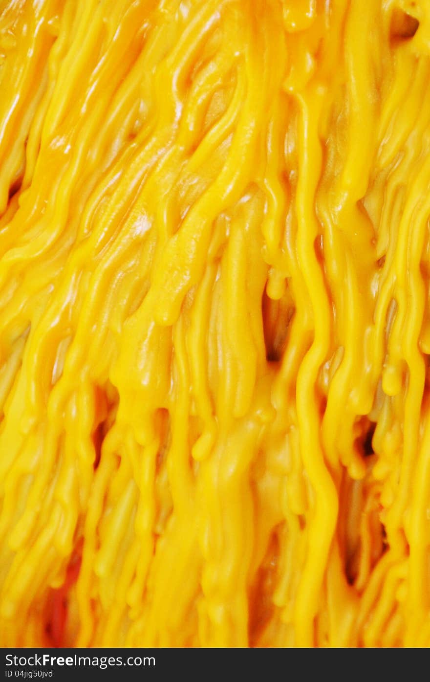 Big yellow candle dripping - close up