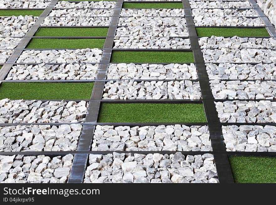 Lawn and stones in rectangle background