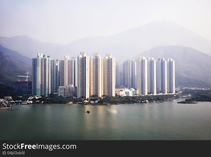 Condominium buildings in front of the mountains in HongKong