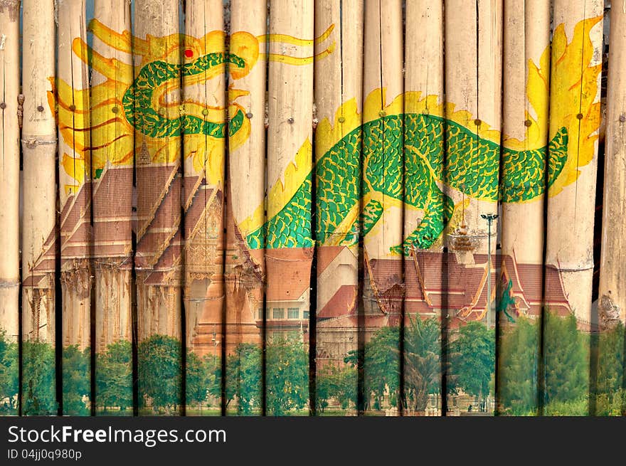 Thai temple and green dragon were painted digitally on bamboo fence. Thai temple and green dragon were painted digitally on bamboo fence