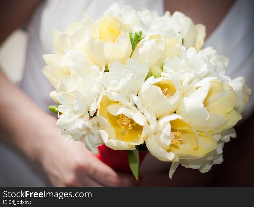 Bride holding white wedding bouquet