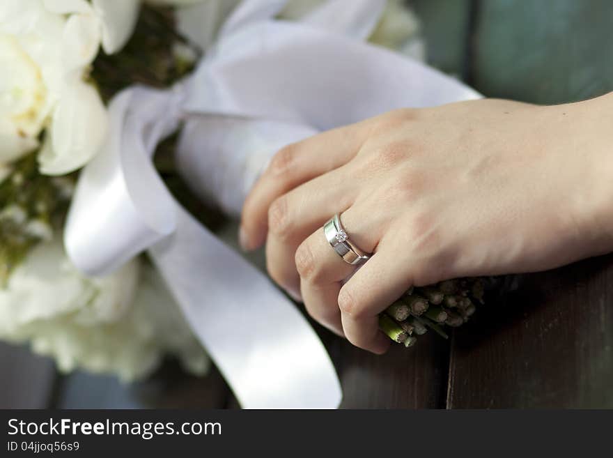 Bride holding white wedding bouquet