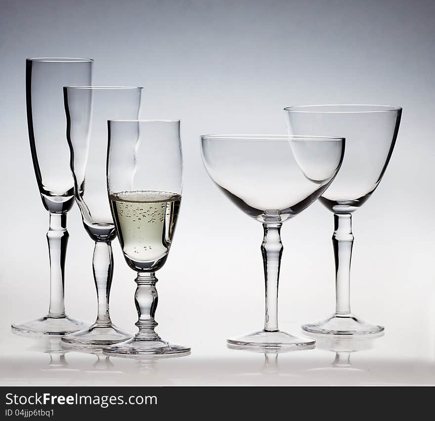 Champagne glassware on blue background